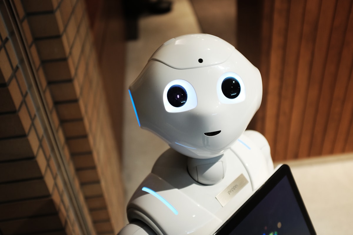 A white humanoid robot, representing automated assistance.