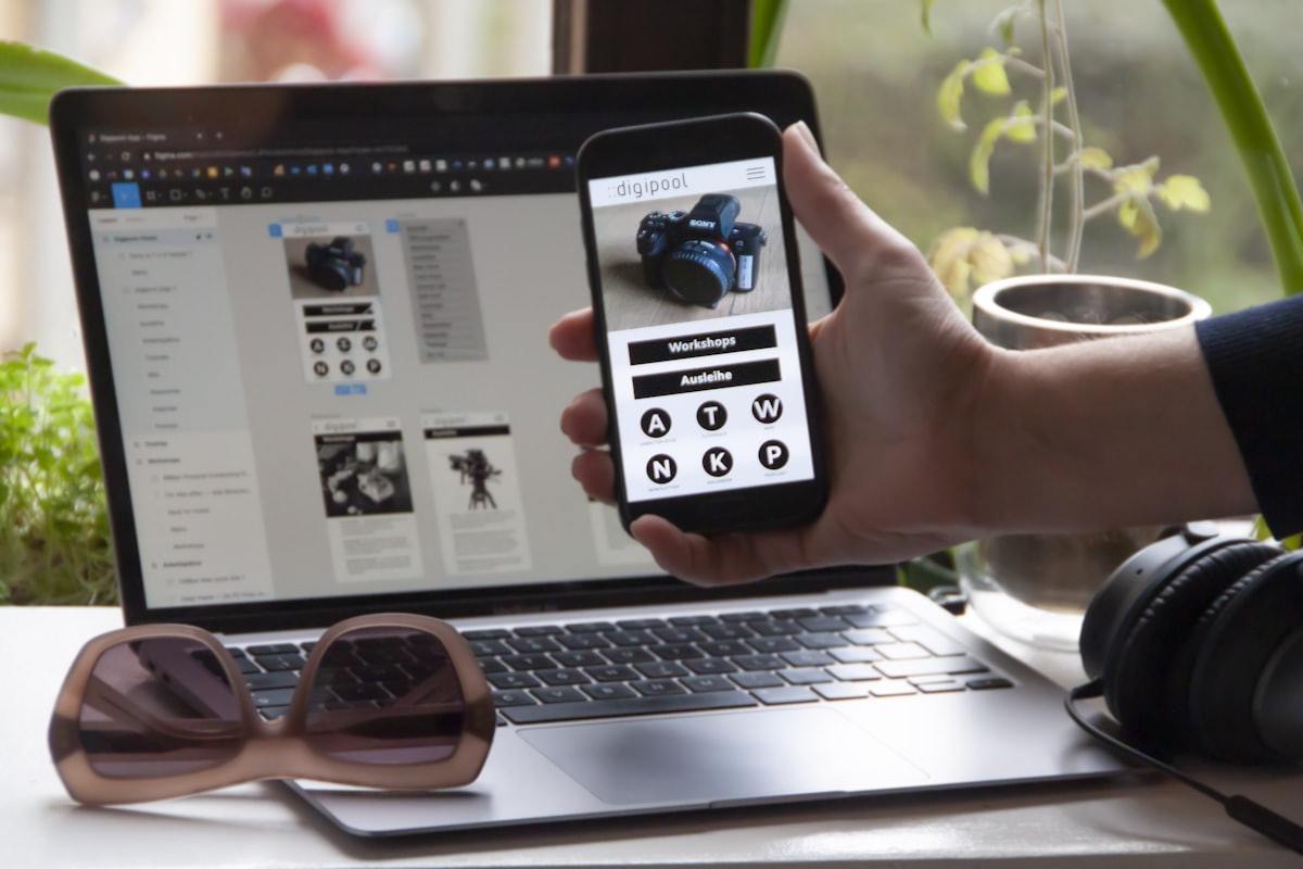 Interface designs displayed on a tablet and a phone side by side.